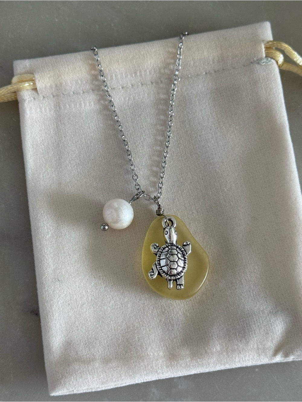 Silver Turtle Pendant Necklace with Yellow Stone and Pearl Accent